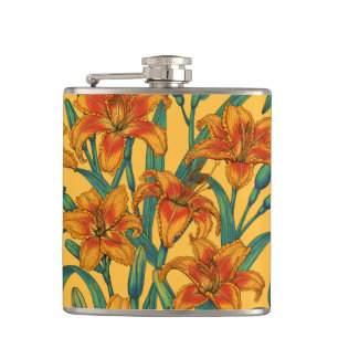 Tawny daylily flowers, blue and yellow hip flask