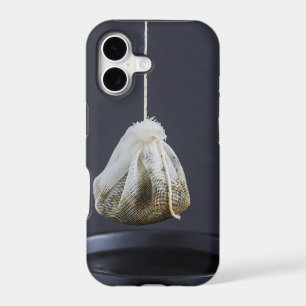 Tea bag is hung in a cup