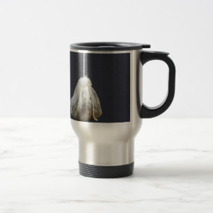 Tea bag is hung in a cup