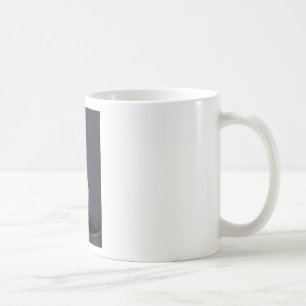 Tea bag is hung in a cup