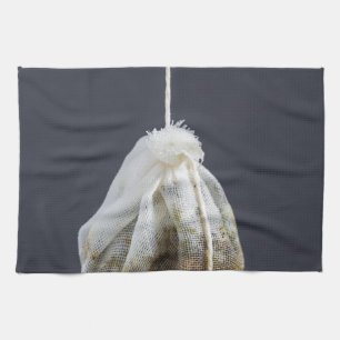 Tea bag is hung in a cup kitchen towel