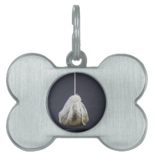 Tea bag is hung in a cup pet name tag