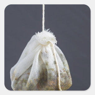 Tea bag is hung in a cup square sticker