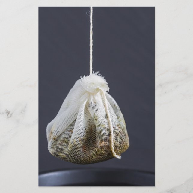 Tea bag is hung in a cup stationery (Front)