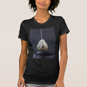 Tea bag is hung in a cup T-Shirt