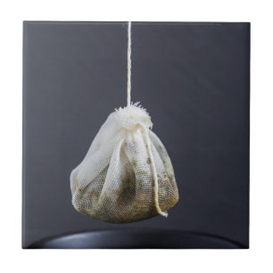 Tea bag is hung in a cup tile