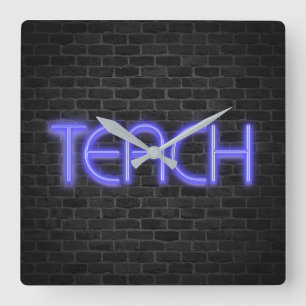 TEACH text in neon lights on brick Square Wall Clock
