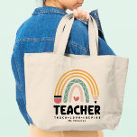Teacher Teach Love Inspire Rainbow Personalized Large Tote Bag<br><div class="desc">Teacher Teach Love Inspire Rainbow Personalized Name Tote Bag features a pencil as part of a rainbow with a love heart with the text "Teacher Teach Love Inspire" in modern script typography with your custom personalized name. Perfect for your favourite teacher for teacher appreciation, birthday, Christmas, holidays and more. Designed...</div>