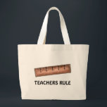 Teachers Rule Teaching Wooden Ruler Teacher Tote<br><div class="desc">Created from an original marker illustration,  this tote bag features a brown wooden ruler with TEACHERS RULE written below. Perfect for your favourite math teacher for teacher appreciation day,  holiday gifts,  or end-of-the-year thank you for anyone in education.</div>