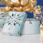 Teal Christmas Snowflakes Wrapping Paper<br><div class="desc">An elegant Christmas wrapping paper featuring a pattern of teal metallic snowflakes set against a paler teal background to add a touch of festive class to your gift giving this holiday season.</div>