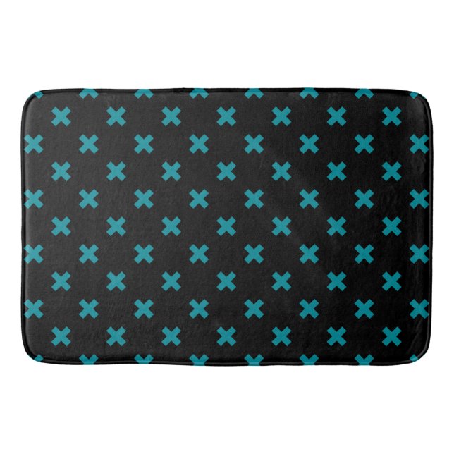 Teal cross stitches on black bath mat (Front)