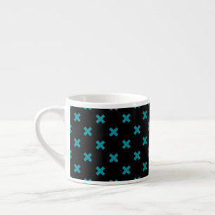 Teal cross stitches on black espresso cup