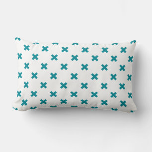 Teal cross stitches on white lumbar pillow