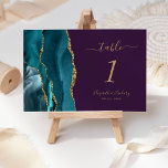 Teal Gold Agate Purple Wedding Table Number<br><div class="desc">The left-hand edge of this elegant modern wedding table number card features a teal blue watercolor agate border trimmed with faux gold glitter. The customizable text combines gold-coloured handwriting,  italic and copperplate fonts on a purple background.</div>