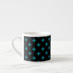 Teal polka crosses on black espresso cup