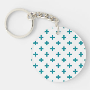 Teal polka crosses on white keychain