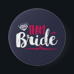 Team Bride Bachelorette Party Wedding Button<br><div class="desc">Team bride button. Perfect for bridal shower and bachelorette party accessories before the wedding. Navy blue,  white and pink with diamond and small hearts. Background colour can be customized to your desired colour theme. This pin is for the bridesmaid,  maid of honour,  bride's families and friends.</div>