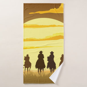 Team of cowboys silhouette galloping against a sun bath towel