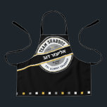 Team Shabbos Kid's Apron on Black with Hebrew<br><div class="desc">Our TREAM SHABBOS Apron on Black is a cool way to get everyone on board with Shabbos prep. Get one for every member of the team and watch them pitch in! ALL text on this branded look can be customized. Practical & fun... Just like your family. Includes the words: TGI...</div>
