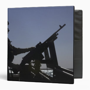 Technician manning an M240 machine gun in Iraq Binder