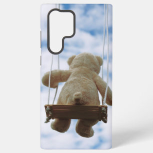 Teddy bear on a swing with a cloudy blue sky. samsung galaxy case