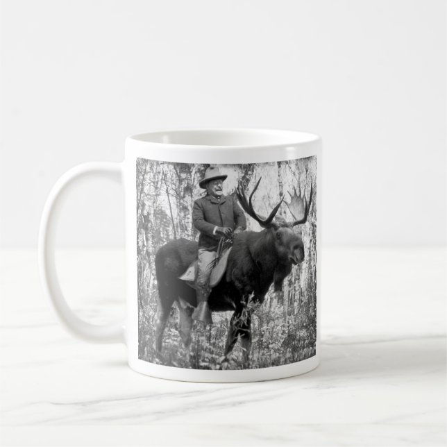 Teddy Roosevelt Riding A Bull Moose Coffee Mug (Left)