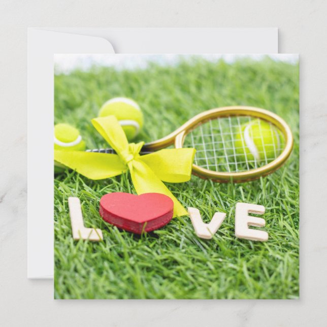 Tennis ball and racket on green grass with love (Front)