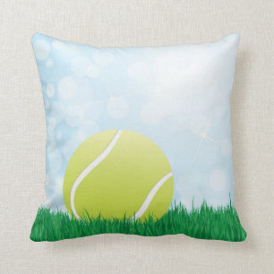 tennis ball on grass throw pillow