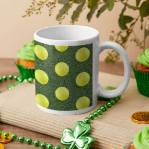 Tennis ball on green grass  coffee mug