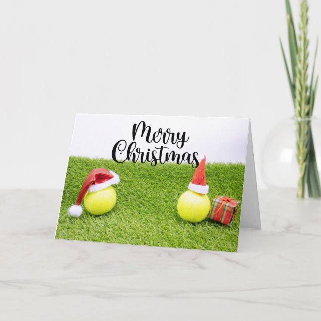 Tennis Christmas with tennis ball and Santa hat Holiday Card (Front)