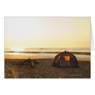 Tent and Burned out Campfire on the Beach.
