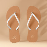 Terracotta Modern Elegant Minimal Simple Monogram Flip Flops<br><div class="desc">These trendy and stylish Terracotta Modern Elegant Minimal Simple Monogram Flip Flops offer a minimalistic design that blends seamlessly with the contemporary aesthetic. The terracotta colour palette adds an elegant touch to your footwear, while the personalized monogram brings a unique and personal aspect to your look. These flip flops make...</div>