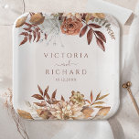 Terracotta Rust Flowers Boho Fall Foliage Wedding Paper Plate<br><div class="desc">Infuse your fall wedding with earthy elegance and modern charm using these fall floral paper plates. These disposable plates feature a captivating design that blends beautifully with your bohemian or rustic autumn theme. Watercolor illustrations of burnt orange florals, copper-toned leaves, and pampas grass are accented with modern, elegant calligraphy, creating...</div>