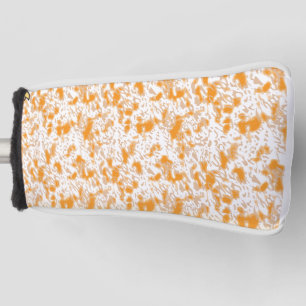 Textile pattern featuring a vibrant orange and gol golf head cover
