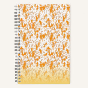 Textile pattern featuring a vibrant orange and gol notebook