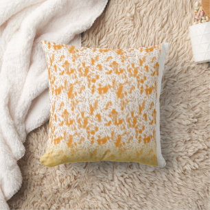 Textile pattern featuring a vibrant orange and gol throw pillow