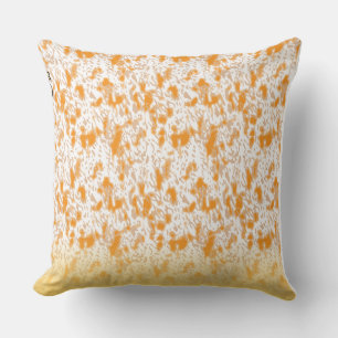 Textile pattern featuring a vibrant orange and gol throw pillow