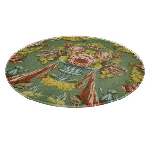 Textile with a repeating floral motif cutting board