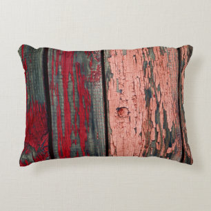 Texture of old wooden fence painted in red and ora accent pillow