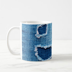 Textured denim background. Torn hole in the fabric Coffee Mug