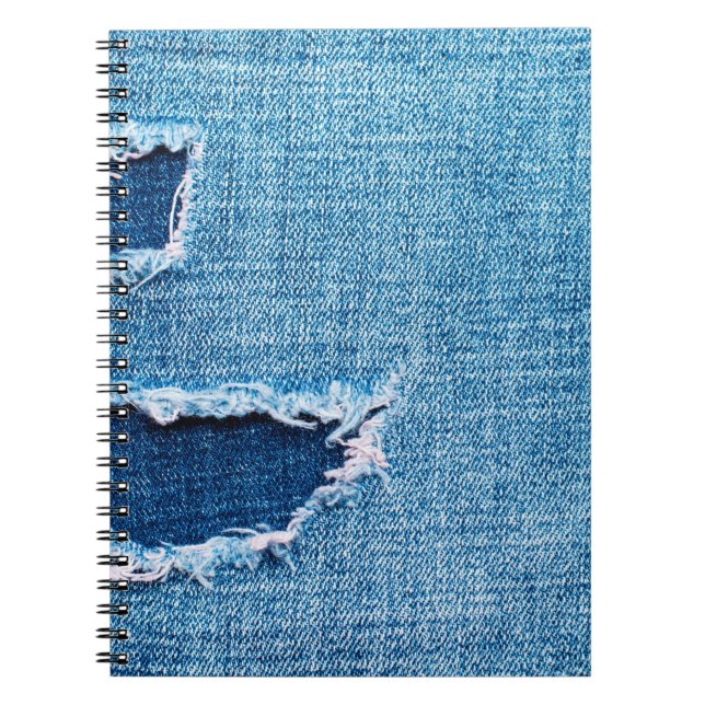 Textured denim background. Torn hole in the fabric Notebook (Front)
