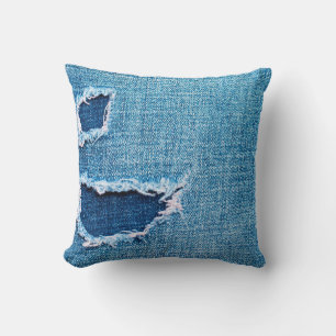 Textured denim background. Torn hole in the fabric Throw Pillow