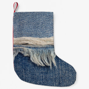 Textures ripped jeans background. small christmas stocking