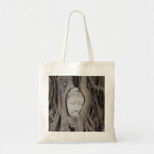 Thailand Head of Buddha surrounded by trees Tote Bag