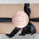Thank You birthday party rose gold glittery stars Classic Round Sticker<br><div class="desc">A sticker, favour tag for a girly birthday. A faux rose gold metallic looking background with an elegant rose gold, copper coloured dripping shining stars. The text: Thank You. Template for name and a date. The name is written in dark rose gold with a large modern hand lettered style script....</div>