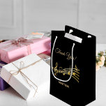 Thank You music notes black gold name Small Gift Bag<br><div class="desc">Black background with faux gold music notes. With the text: Thank You! Golden hand lettered style script. Template for a name or names.
Perfect as a favor bag for a birthday party,  wedding,  wedding anniversary,  baby shower or bridal shower!</div>