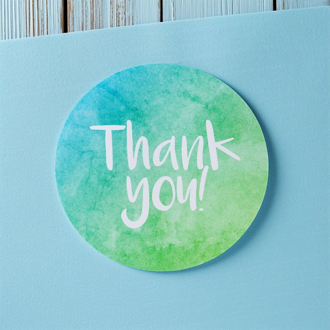 Thank you watercolour bright green sticker (Round thank-you sticker with a blue and green watercolor gradient and handwritten-style white text)