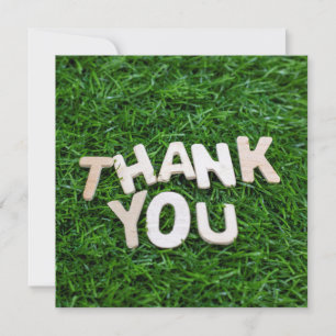 Thank you word on green grass background