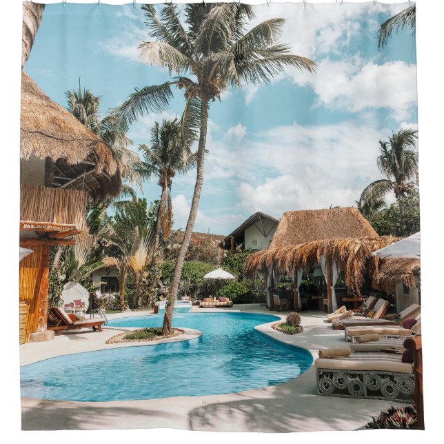 Thatch huts and houses by the pool during day (Front)