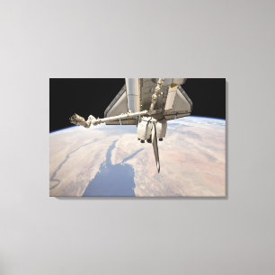 The aft section of the docked space shuttle canvas print